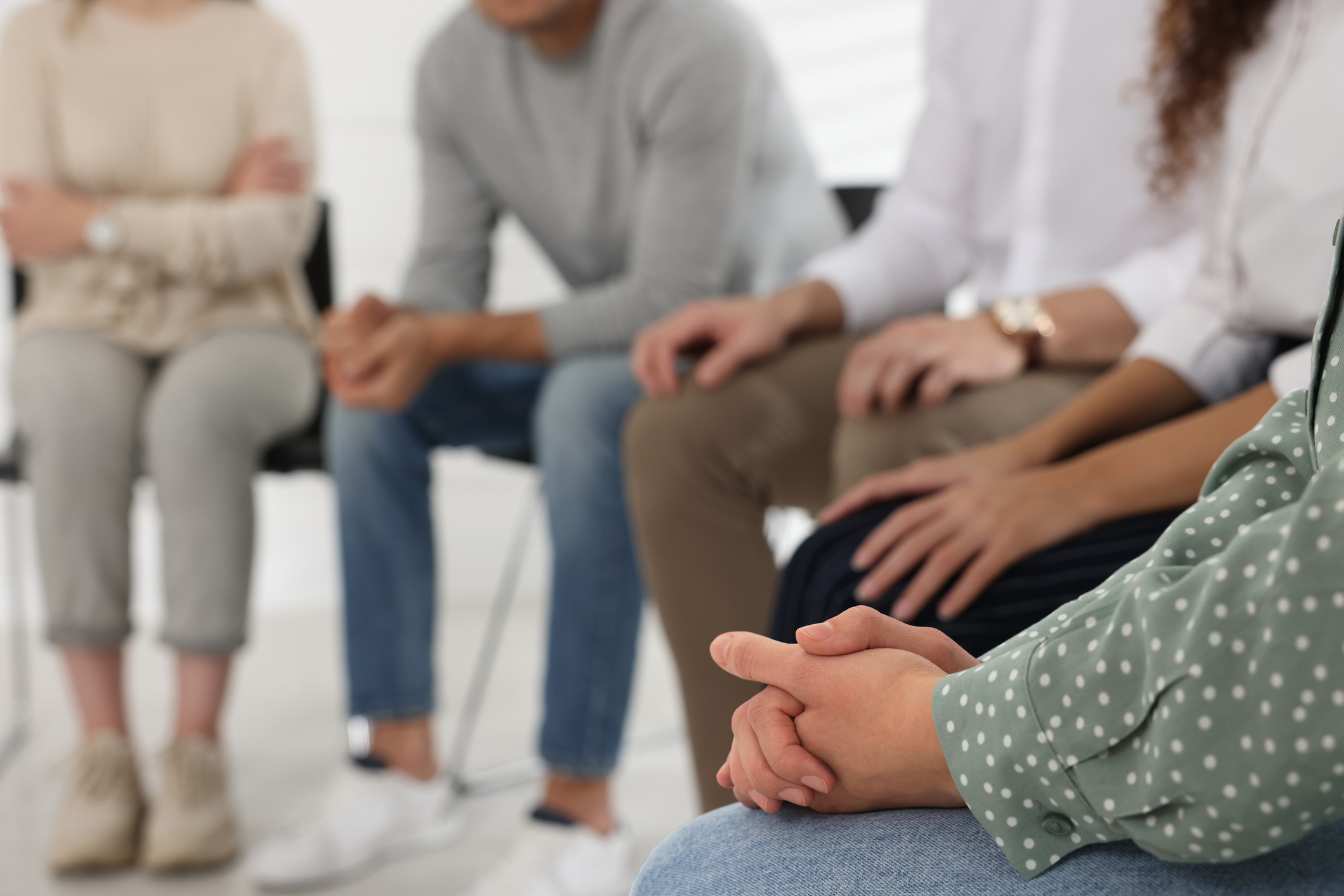 People at group therapy session indoors, closeup People at group therapy session indoors, closeup