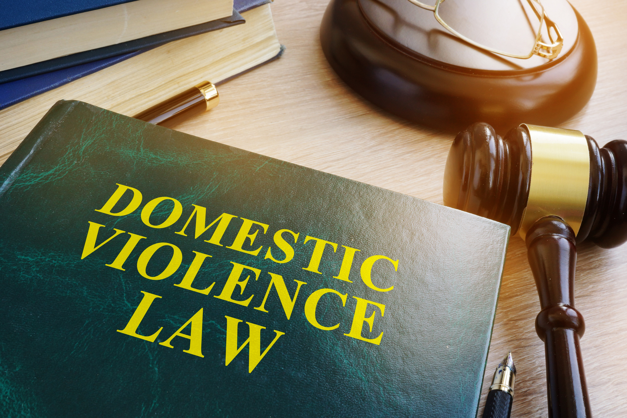 Domestic violence law on a wooden table. Domestic violence law on a wooden table.